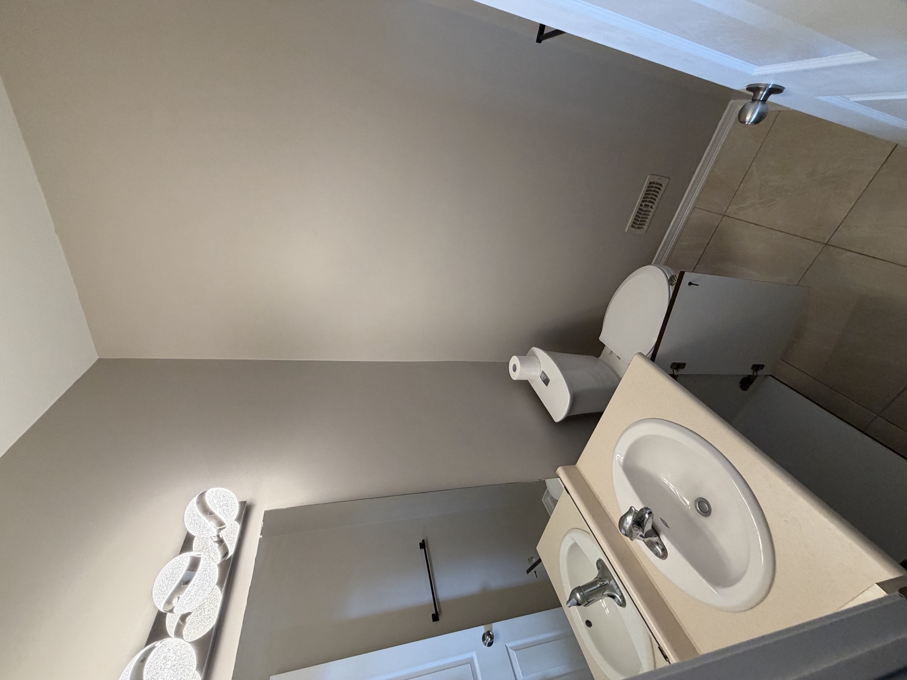 Original powder-room vanity, mirror and wall finish